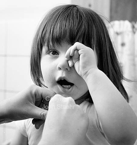 Sleepy little girl, Pia, 18 months old.
14-01-64.
6x6, tiff, 300 dpi, size: 4 - 7 MB. sa6412704.jpg